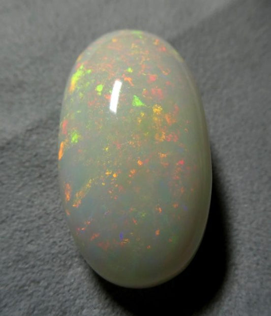 65.65CT UNTREATED JUMBO RAINBOW FLASHING 100% NATURAL CRYSTAL OPAL